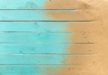 Foto op Plexiglas Zeezand op blauwe houten vloer, bovenaanzicht met kopieerruimte © showcake