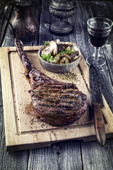 Barbecue Wagyu Tomahawk Steak as close-up on Cutting Board