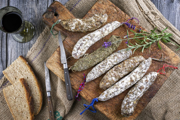 French Salami as top view on old Cutting Board