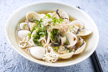 Traditional Japanese Clam Ramen Soup as close-up in a Bowl