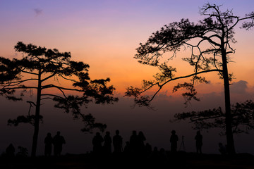 Fototapeta na wymiar silhouette group of people standing in sunset