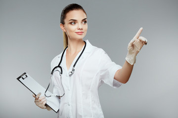 Beautiful nurse in white medical robe