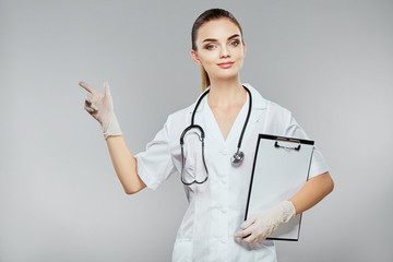 Beautiful nurse in white medical robe