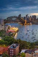 Foto op Canvas Sydney. Stadsbeeld van Sydney, Australië met Harbour Bridge en de skyline van Sydney tijdens twilight blue hour. © rudi1976