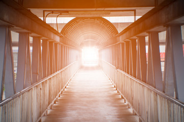 Orange light on pedestrian overpass concept for light discovery.