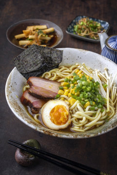 Traditional Japanese Ramen Yakibuta with Enoki and Egg as close-up in a bowl