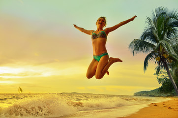 The concept of freedom. Free Happy Woman Enjoying Nature. Beauty Girl in sea waves.