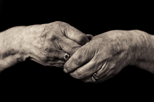 Older lady's hands. Widows grief in old age concept