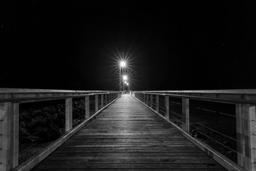 Obraz premium Wellington Point jetty and night lights - black and white