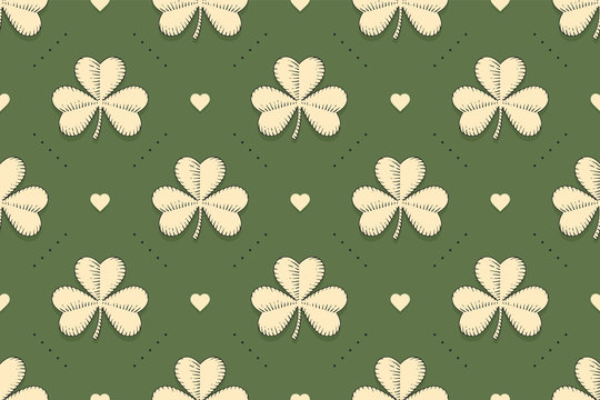 Seamless irish green pattern with clover and heart on green background. Pattern for St. Patrick Day. Old school hand-drawn design in engraving style for wrapping paper, background. Vector Illustration