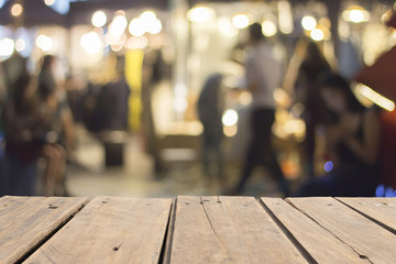 Night market walk street blurred background,wooden table