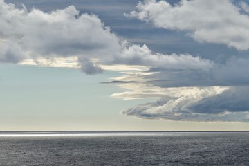 Fototapeta na wymiar Scenic clouds over sea
