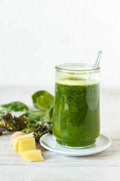 Homemade green smoothie with pineapple, spinach, nettle and ginger