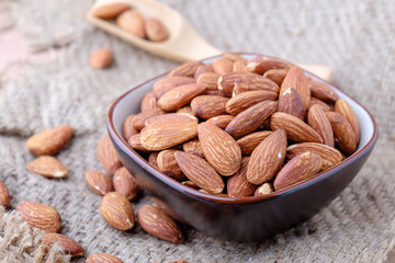 Almonds on sackcloth background