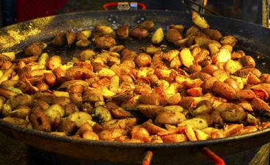 Fried potatoes in a large frying pan