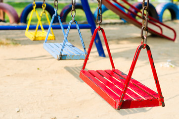 metal swing colorful in playground. - obrazy, fototapety, plakaty