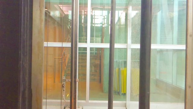 transparent glass elevator in the modern building