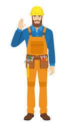 Worker greeting someone with his hand raised up