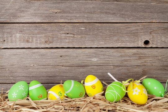 Easter eggs in front of wooden wall