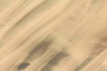 Trails of dust and shifting sand dunes textures