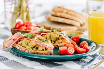 Sandwiches with scrambled eggs and bacon