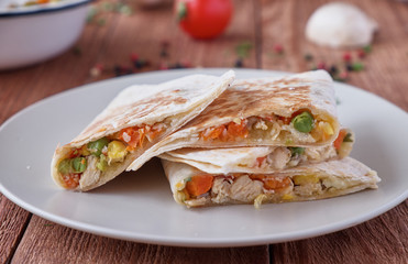 Quesadilla with cheese, chicken, mushrooms and vegetables