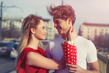 Happy young couple dating outdoor on Margaret Bridge, Budapest