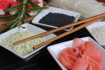 preparing sushi, making sushi, preparing japanese food, making japanese food, ginger, red ginger, sesame, black sesame, chopsticks, wasabi, rice, special rice, special rice for sushi, surimi, 