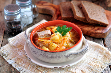 Soup of beef ribs, sauerkraut, onions, carrots and parsley.