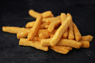 French fries on blackboard background.