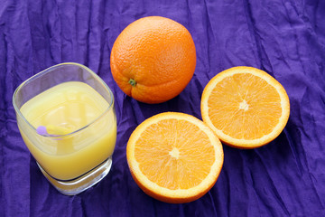 delicious orange juice breakfast drink: oranges and freshly squeezed glass of juice