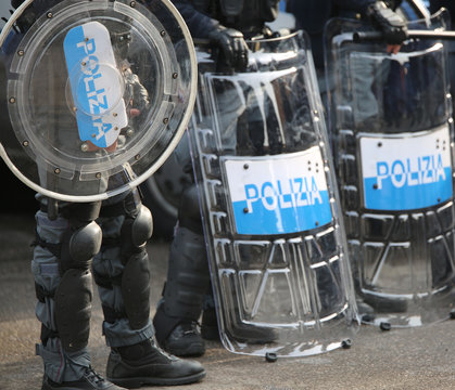 police with shields and riot gear during the sporting event