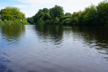 Rural landscape water with green trees