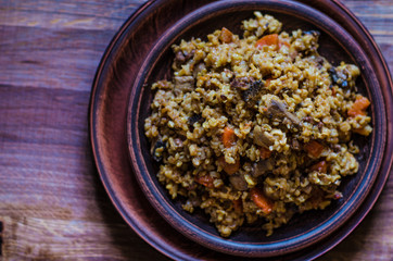 Vegetarian pilaf with carrots mushrooms and walnuts