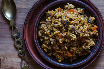 Vegetarian pilaf with carrots mushrooms and walnuts