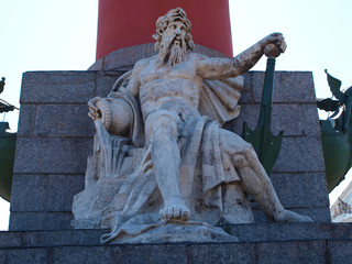 Statue of Poseidon at rostral Columns on Vasilievsky Island in Saint-Petersburg, Russia