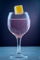 Glass of mineral carbonated water with fruit ice
