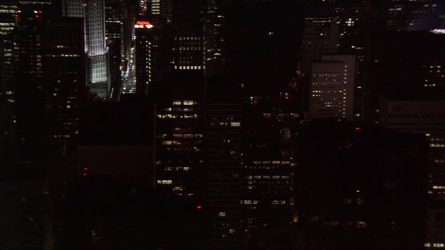Close night flight past New York City skyscrapers. Shot in 2005.