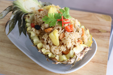 Baked rice with pineapple served in a pineapple