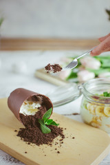 Chocolate dessert in the form of a fallen flower pot