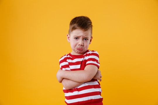 Portrait of a sad upset little boy crying