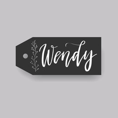 Common female first name Wendy on a tag. Hand drawn calligraphy