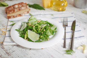 vegetarian Green salad with Parmesan arugula avocado nuts
