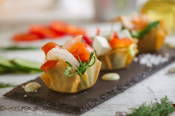 Salad with shrimps cherry feta cheese and greens