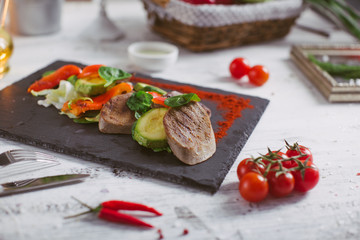 Beef tongue grilled with herbs and vegetables