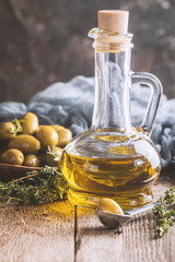 Olive oil and bowl of olives