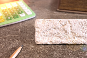 White stone tablet for copy space on the calculator background