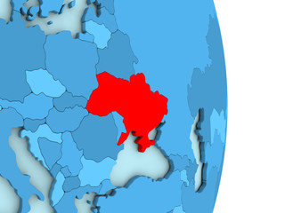 Ukraine on blue political globe