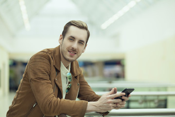 young stylish businessman with tablet