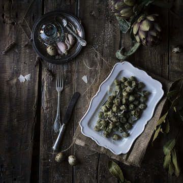 Spinach gnocchi on rustic table